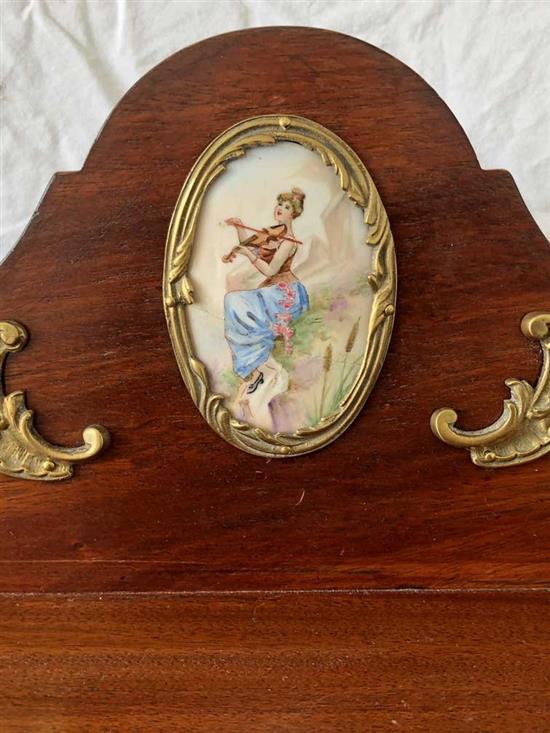 A mahogany cabinet with porcelain panels and brass filigree W.68cm